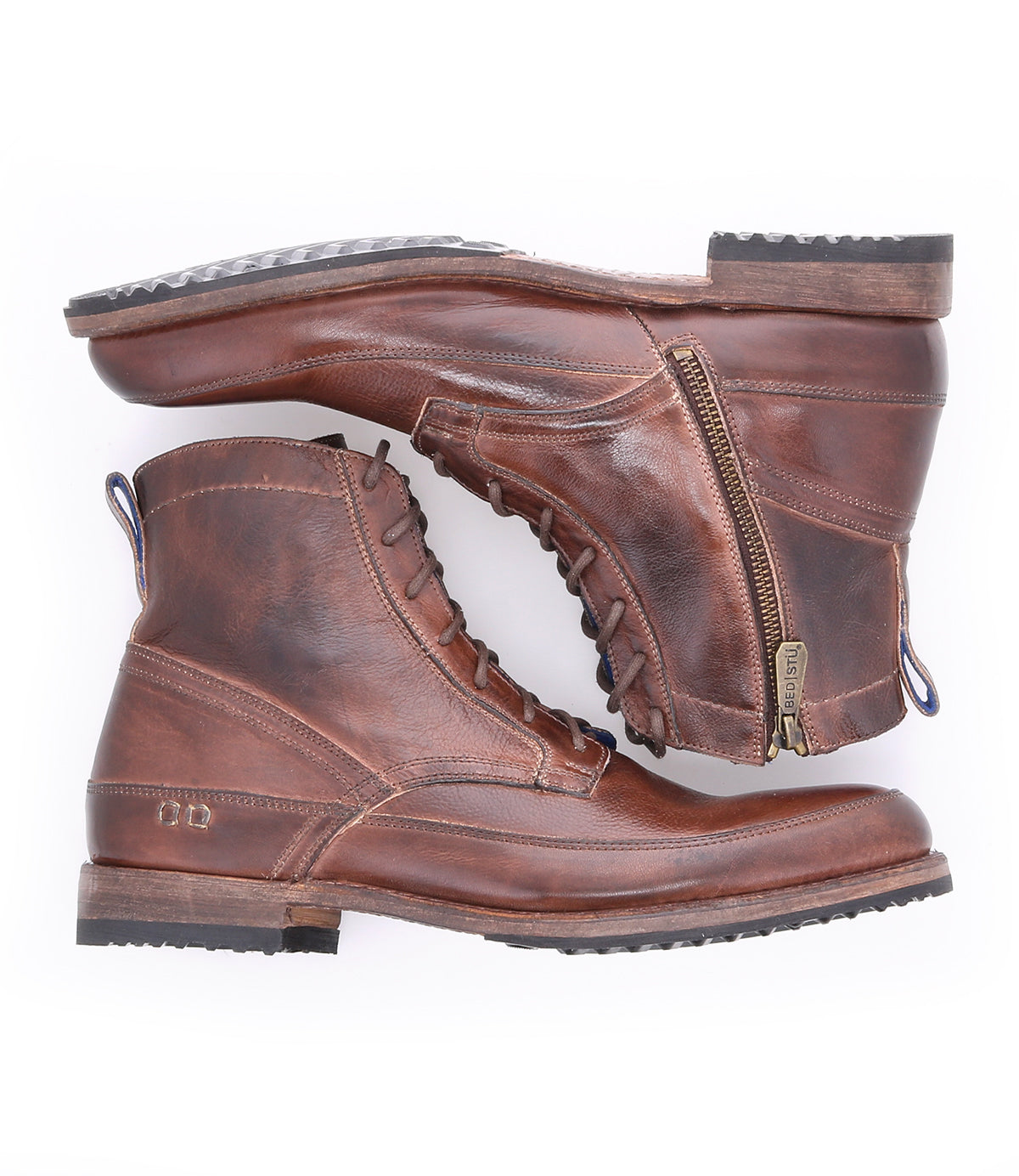 A pair of Bed Stu Spiker brown leather lace-up ankle boots with laces on one and a zipper on the other, displayed top-down on a white background.