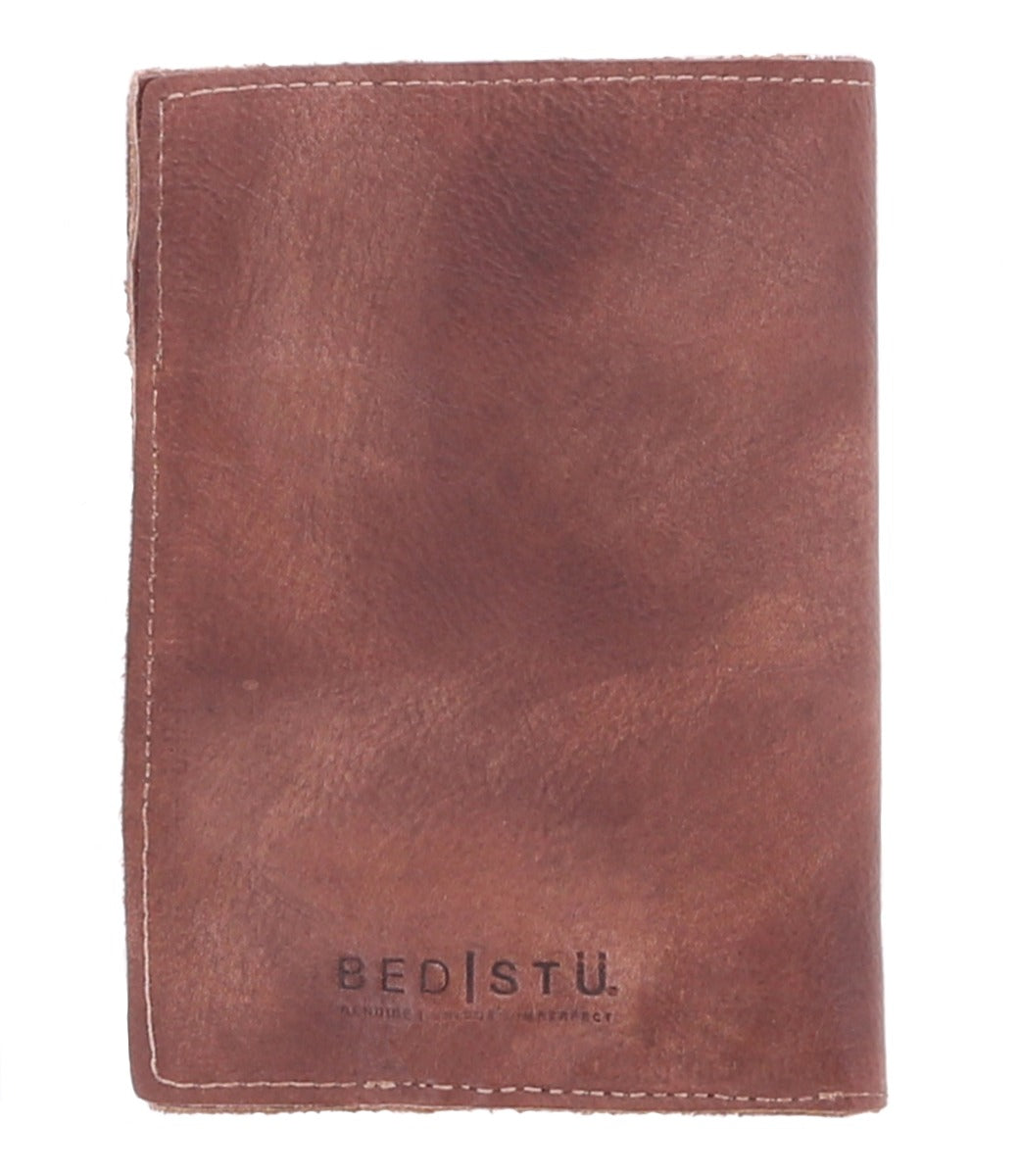 A brown leather Stardust passport holder by Bed Stu.