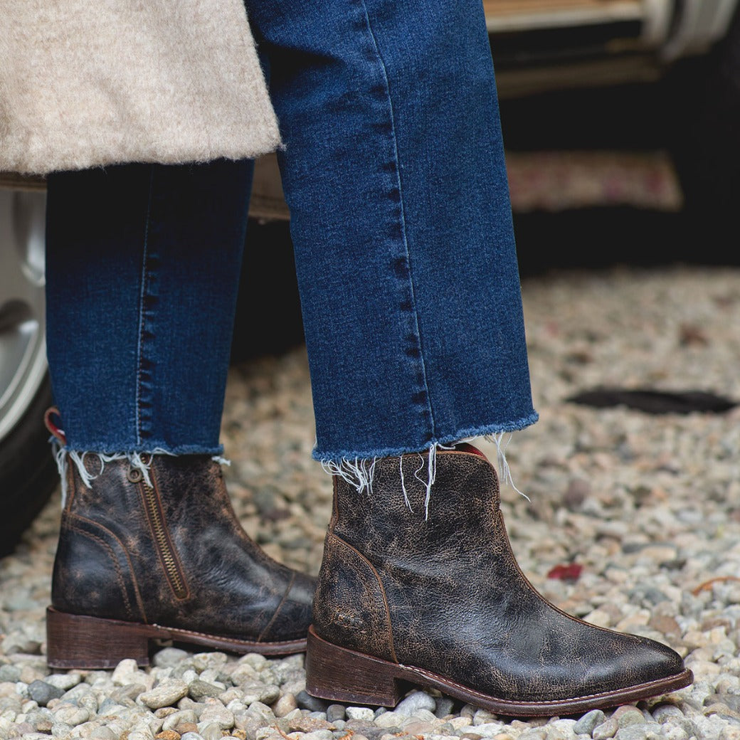 A woman wearing jeans and a pair of Bed Stu Tabitha boots.
