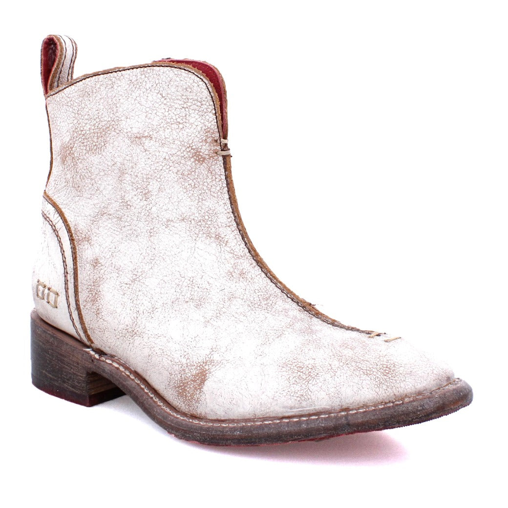 A women's white ankle boot with a red zipper called Tabitha by Bed Stu.