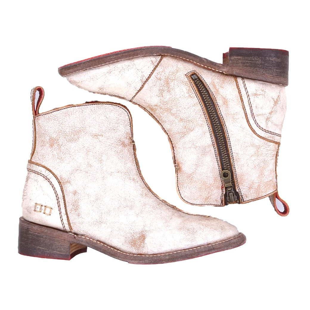 A pair of Tabitha women's white leather ankle boots by Bed Stu.