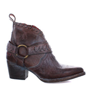 A women's brown ankle boot with a buckle, called "Tania" by Bed Stu.