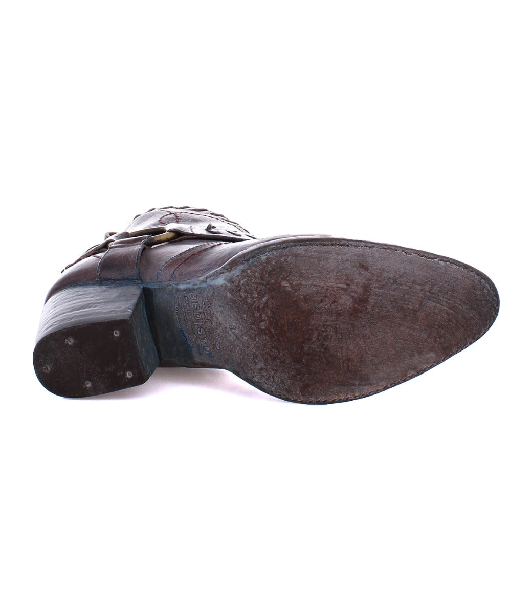 A pair of Bed Stu Tania brown leather boots on a white background.