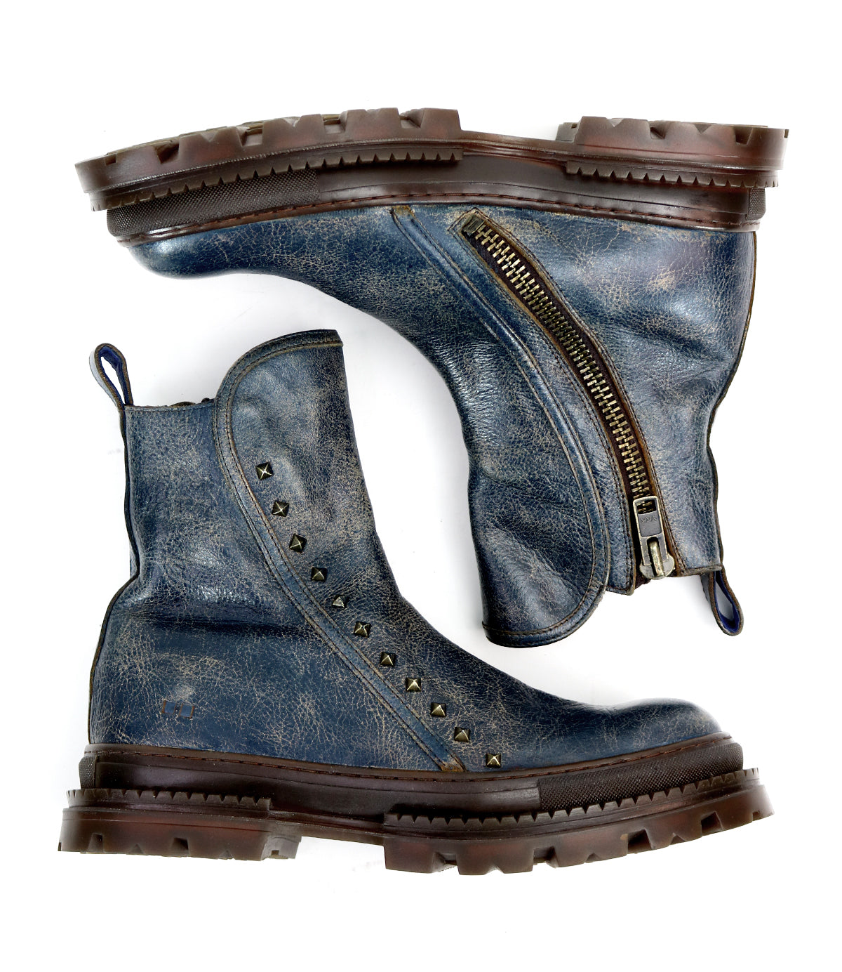 The Bed Stu Tanto boots for men feature worn blue leather, chunky brown soles, a side zipper, and decorative metal studs on the outer side—shown from both top and side views for European-inspired style.