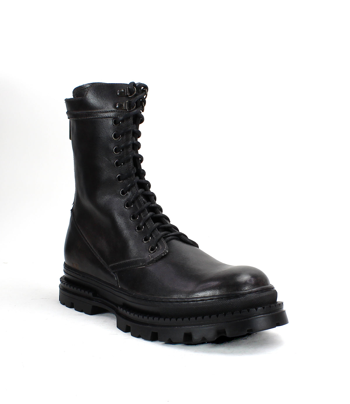 The Bed Stu Tempt boot in black leather, shown against a white background, features a thick rugged sole and a stylish hybrid design that merges combat boot durability with modern street style.