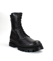 The Bed Stu Tempt boot in black leather, shown against a white background, features a thick rugged sole and a stylish hybrid design that merges combat boot durability with modern street style.