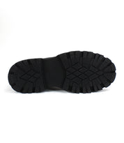 The Bed Stu Tempt features a black rubber sole with a deep, rugged hiking boot-inspired tread pattern, shown against a plain white background.