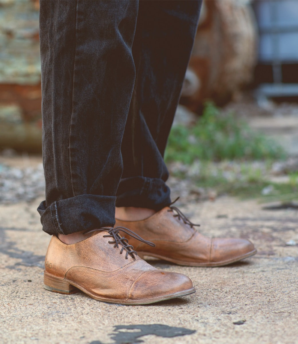 A man wearing a pair of Thorn oxford shoes by Bed Stu.