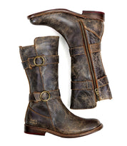 The Turn by Bed Stu is a distressed brown leather short boot with adjustable straps, side zippers, and Goodyear welted construction for enhanced durability.