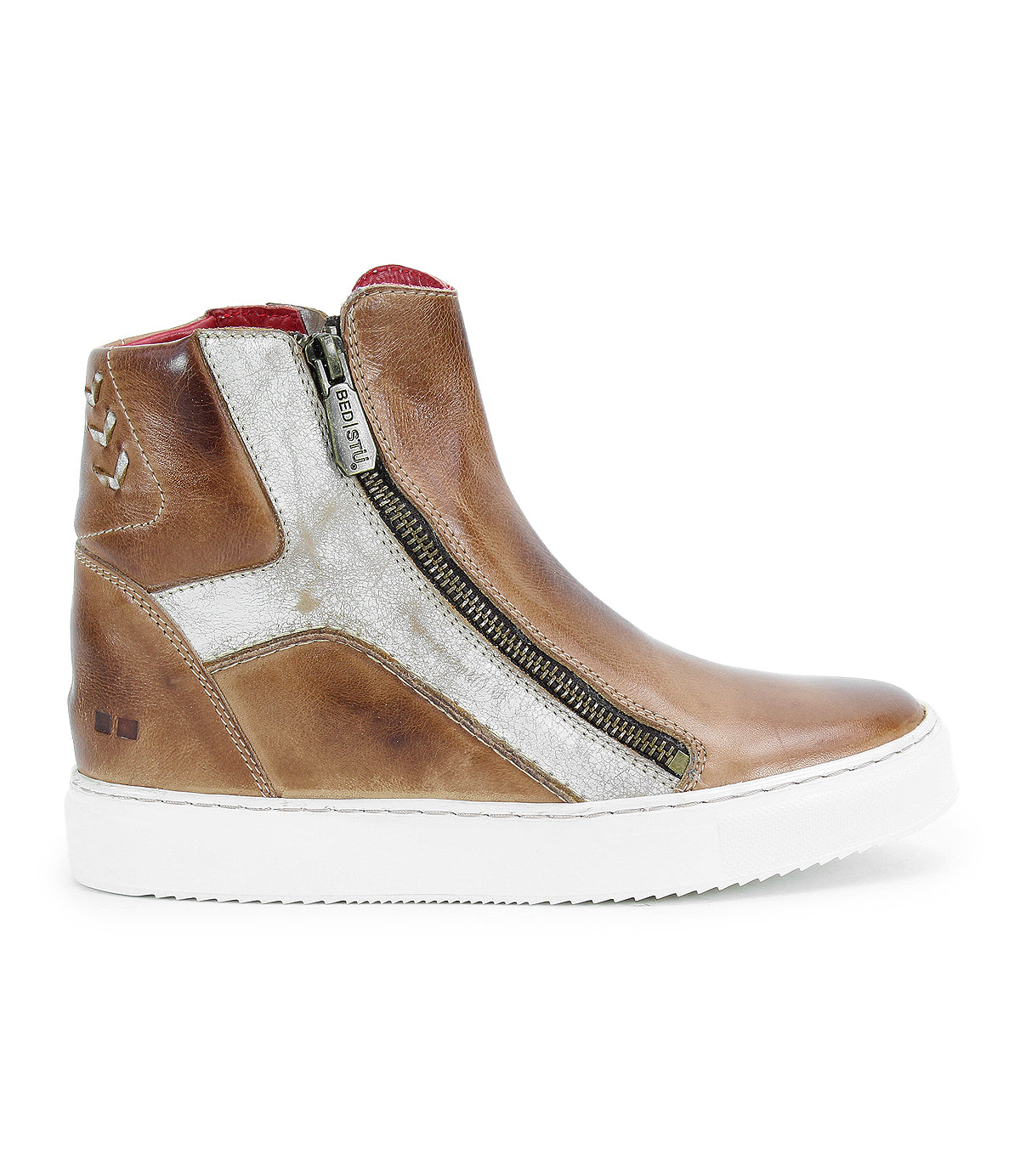The Bed Stu Twist is a brown leather high-top sneaker with a white sole, side zipper, metallic silver accents, leather panels, red inner lining, heel stitching detail, and a subtle hidden wedge for extra height.