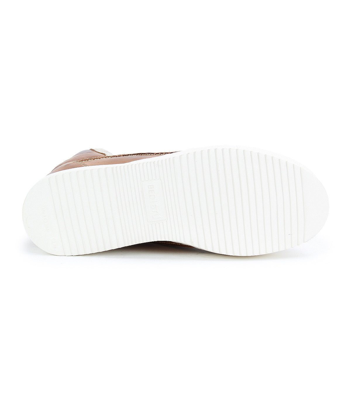 The image shows the white, flat, grooved sole of the Bed Stu Twist brown high-top sneaker, viewed from the bottom.