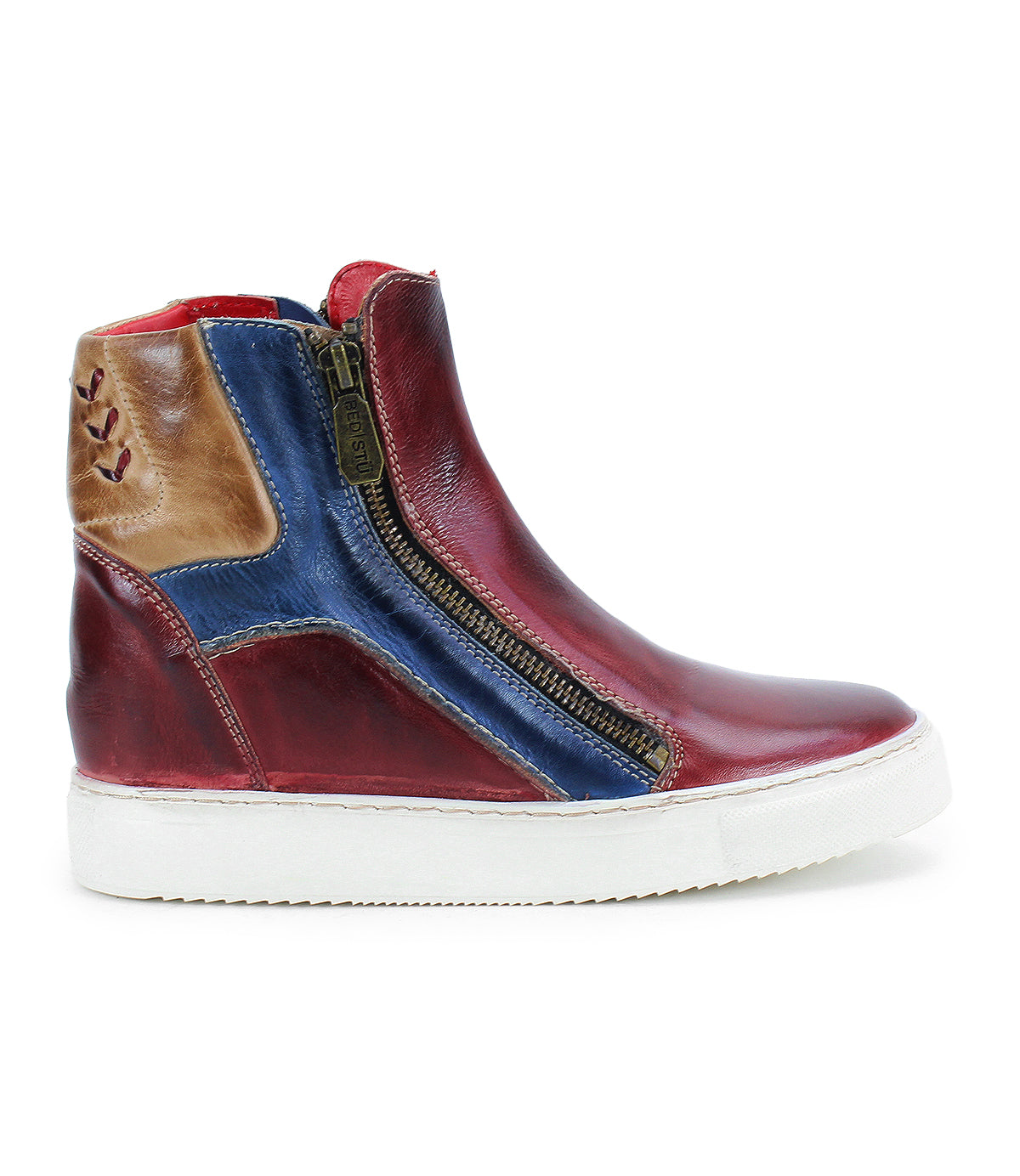 The Bed Stu Twist is a high-top sneaker featuring red, blue, and brown leather panels, a white sole, side zippers, and a hidden wedge for added height.