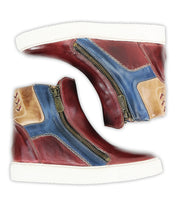 Bed Stu 'Twist' leather high-top sneakers feature red, blue, and tan leather panels, white soles, hidden wedge heels, and side zippers, displayed with inner sides facing up.