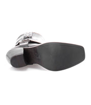 A pair of Vamoose black leather boots on a white background by Bed Stu.