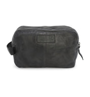 A Yatra by Bed Stu black leather toiletry bag on a white background.