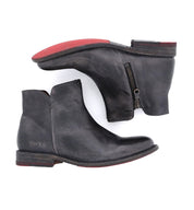 A pair of Yurisa black leather ankle boots with red soles by Bed Stu.