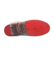 Sole of Yurisa tan pure leather boots.