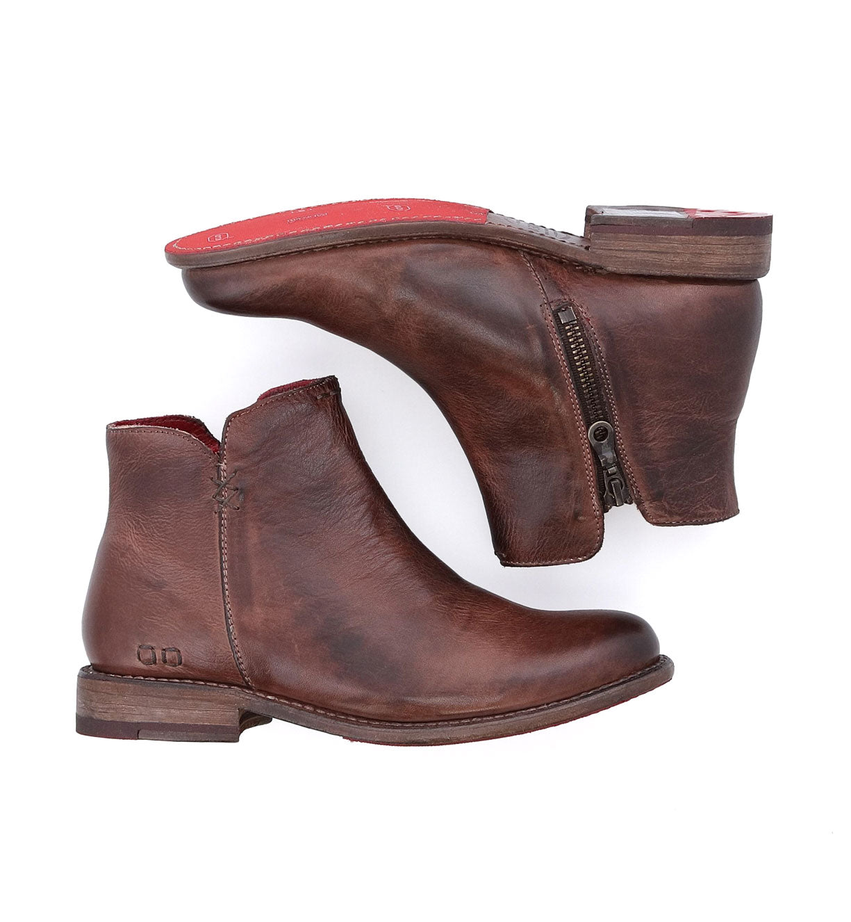 A pair of Yurisa teak leather ankle boots with red soles by Bed Stu.