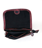 Open the Ziggy red leather purse by Bed Stu, featuring a sleek black interior, multiple compartments, and a snap closure, offering hands-free convenience for the on-the-go lifestyle.