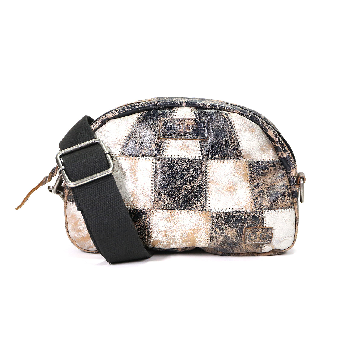 A small, checkered-patterned sling bag with a black strap, featuring various shades of brown and white. The Abundance bag from Bed Stu has visible branding and a zipper closure.