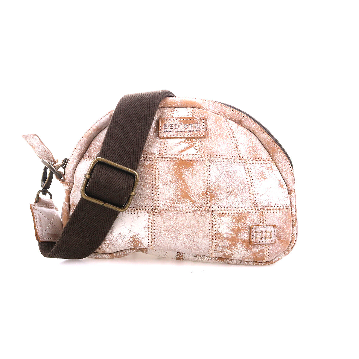 The Bed Stu Abundance is a small, dome-shaped sling bag with a light brown and white checkered patchwork design, featuring a wide dark brown adjustable strap and visible zipper for hands-free convenience.