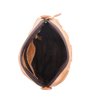 Top view of an open, empty Bed Stu Abundance tan leather sling bag showing a black fabric interior, isolated on a white background.