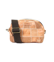 A small tan Abundance sling bag from Bed Stu with a brown strap and visible stitching, isolated on a white background.