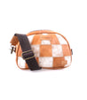 A patchwork leather sling bag with a brown adjustable strap, featuring embossed Bed Stu branding, displayed on a white background.