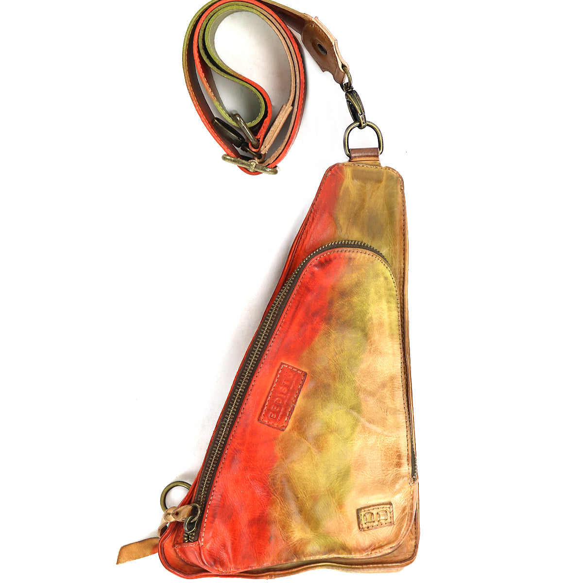 The Adept by Bed Stu is a triangular, multicolored crossbody fanny pack made from vegetable-tanned leather, featuring a zippered pocket and an adjustable strap.