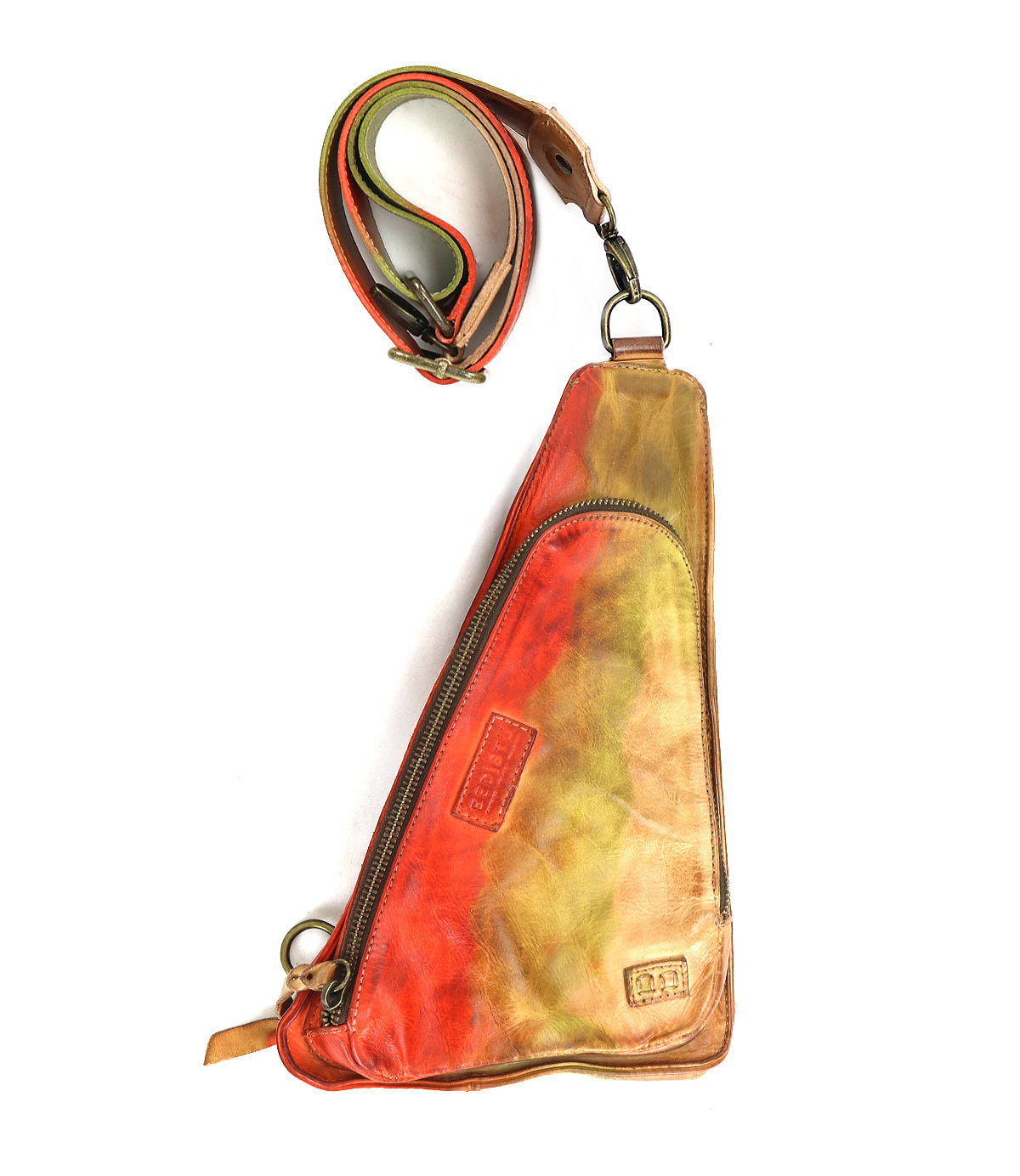 The Adept by Bed Stu is a triangular, multicolored crossbody fanny pack made from vegetable-tanned leather, featuring a zippered pocket and an adjustable strap.