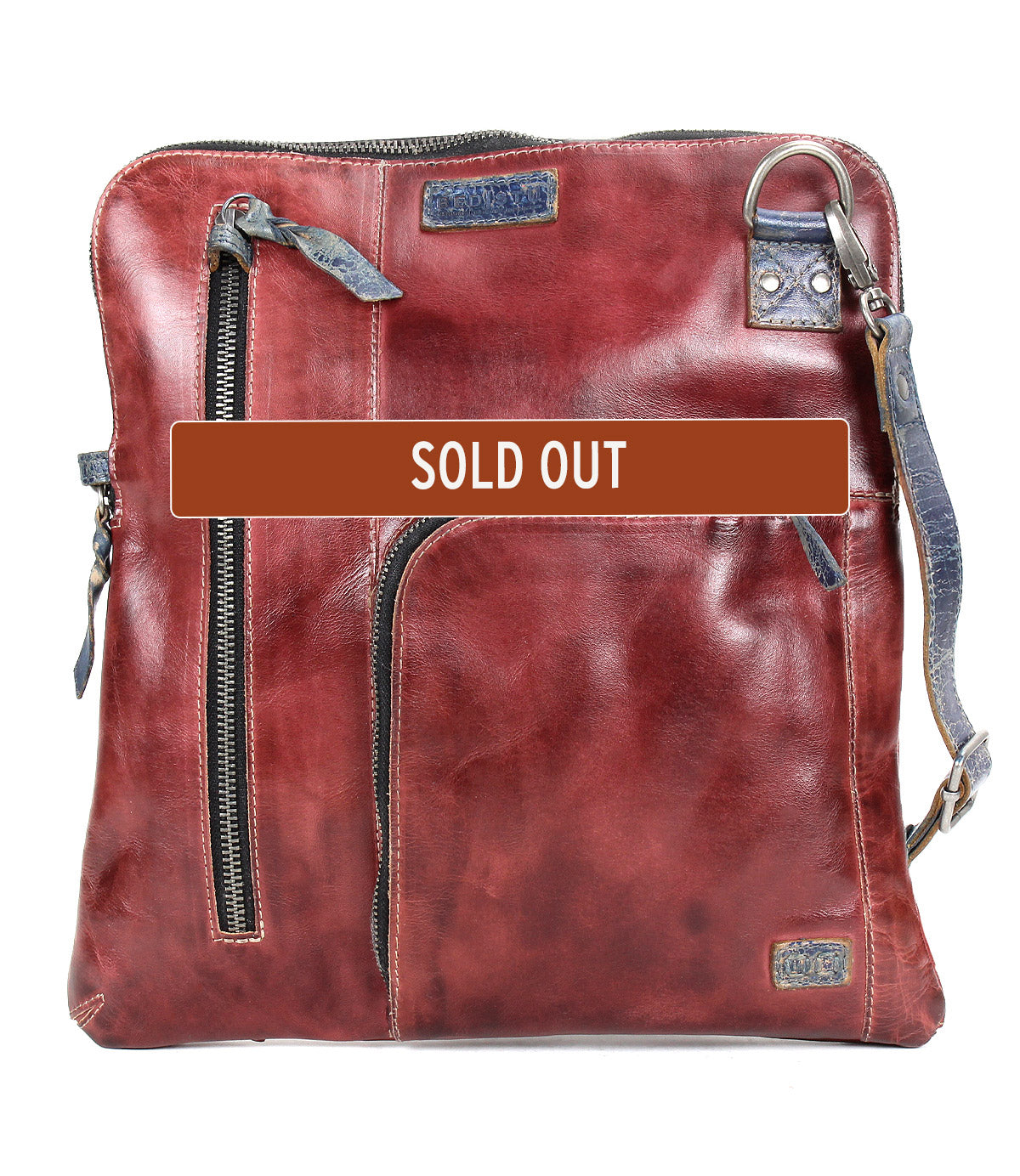The Bed Stu Aiken is a brown leather convertible crossbody bag with multiple zippered pockets, an adjustable strap, and a bold "SOLD OUT" label across the front.