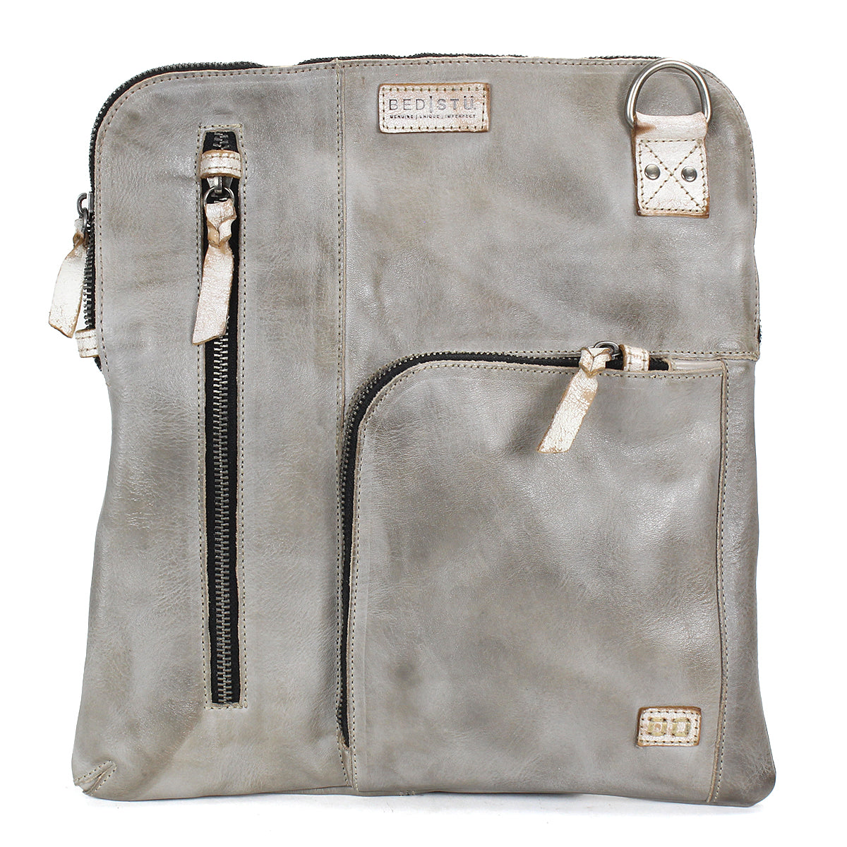 The Bed Stu Aiken is a square gray leather convertible crossbody bag featuring two front zippered pockets, a metal ring accent, stitched brand labels, and an adjustable strap for versatile styling.