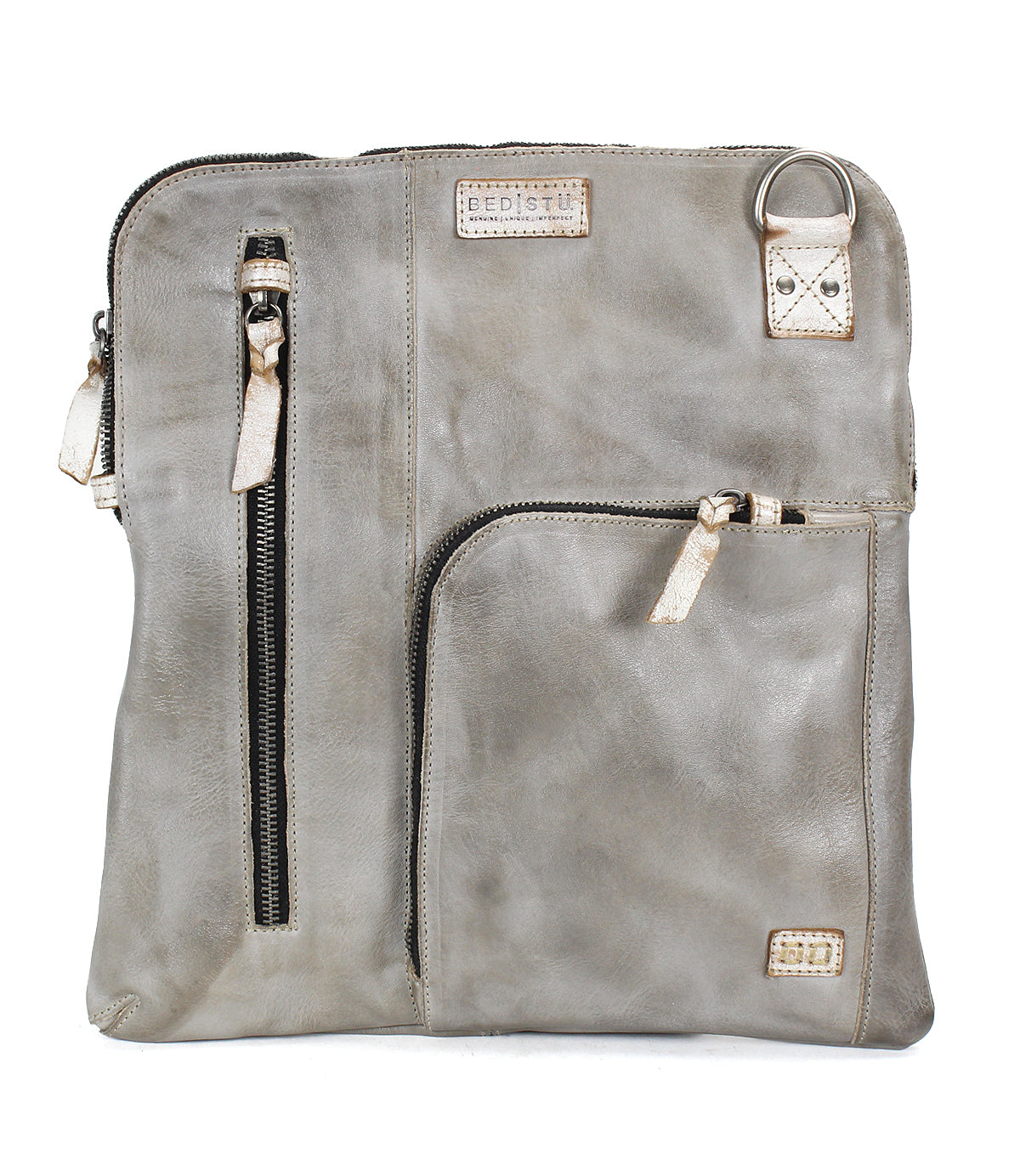 The Bed Stu Aiken is a square gray leather convertible crossbody bag featuring two front zippered pockets, a metal ring accent, stitched brand labels, and an adjustable strap for versatile styling.