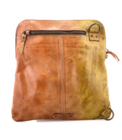 The Bed Stu Aiken is a brown leather convertible crossbody bag with an adjustable, removable strap. It features a zippered front pocket, visible stitching, metal ring on the top corner, secure metal zip-top closure, and brand logo at the bottom.