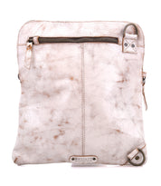 The Bed Stu Aiken is a square crossbody bag in distressed white leather, featuring an adjustable strap, front zipper pocket, metal hardware, and a small logo patch at the bottom.