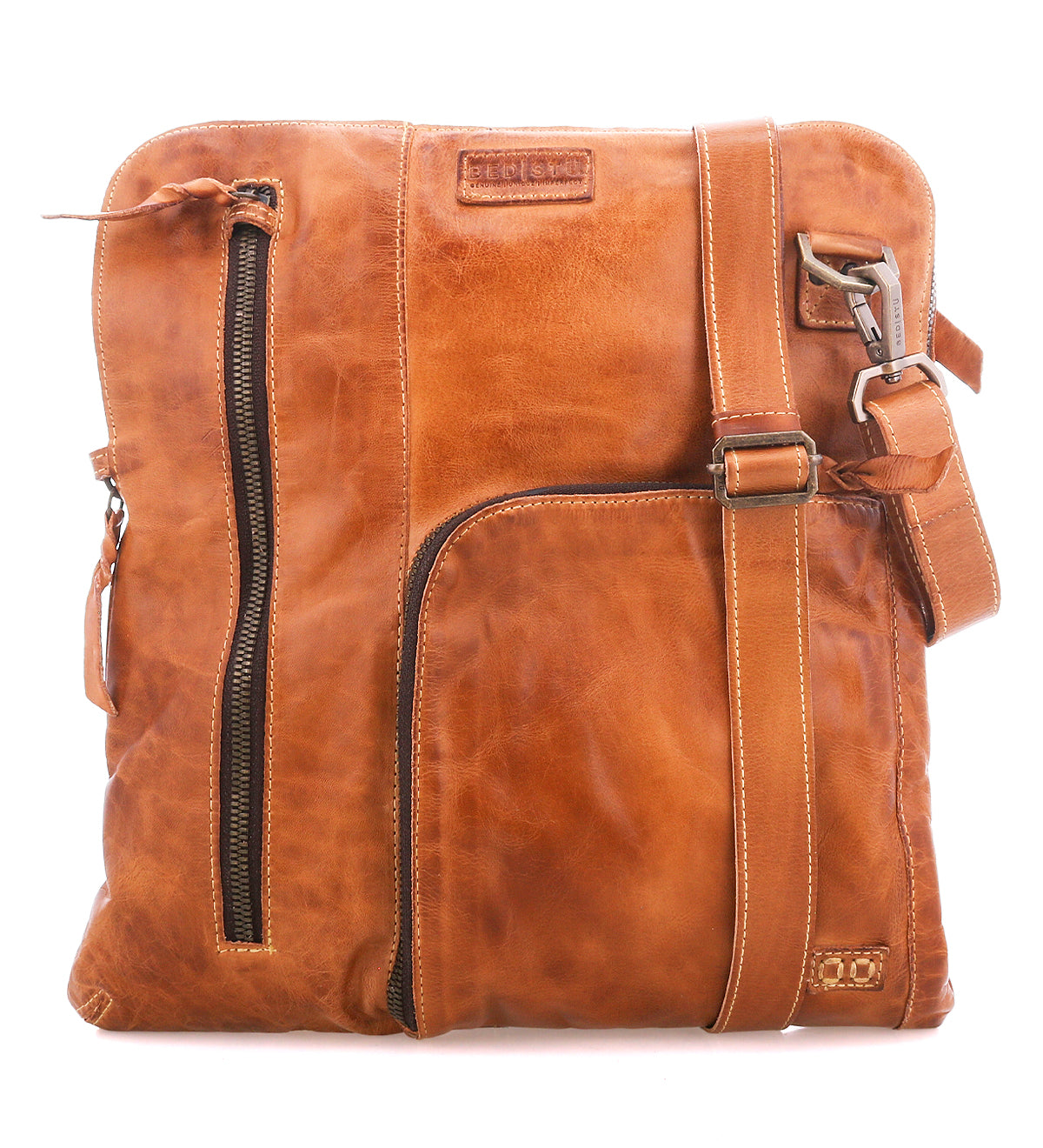 The Bed|Stü Aiken crossbody bag is crafted from full-grain leather and features an adjustable strap, front zipper pockets for easy access, and a stitched logo patch near the top. For added peace of mind while you're on the go, it also includes anti-theft security features.