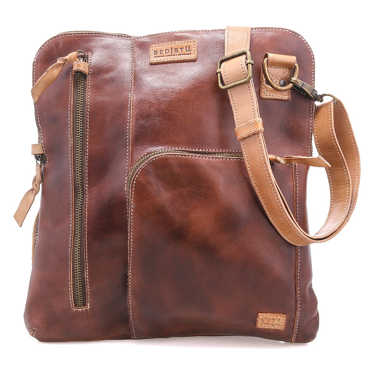 The Bed Stu Aiken is a brown full-grain leather crossbody bag featuring multiple zippered pockets and an adjustable tan strap for style and security, shown against a white background.