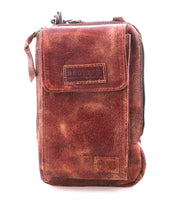 The Bed Stu Alelike is a compact, brown distressed leather crossbody bag with flap and zipper closure, visible stitching, and textured finish—ideal for carrying your phone in style.