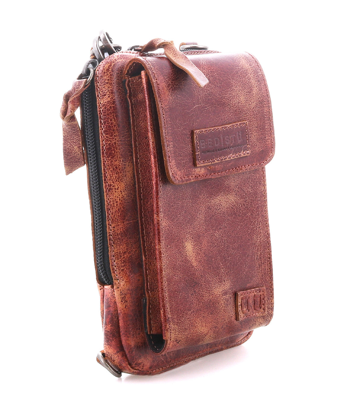 The Bed Stu Alelike is a compact brown pouch made of distressed premium leather, featuring a front flap pocket, zipper compartment, and visible stitching, shown standing upright on a white background.