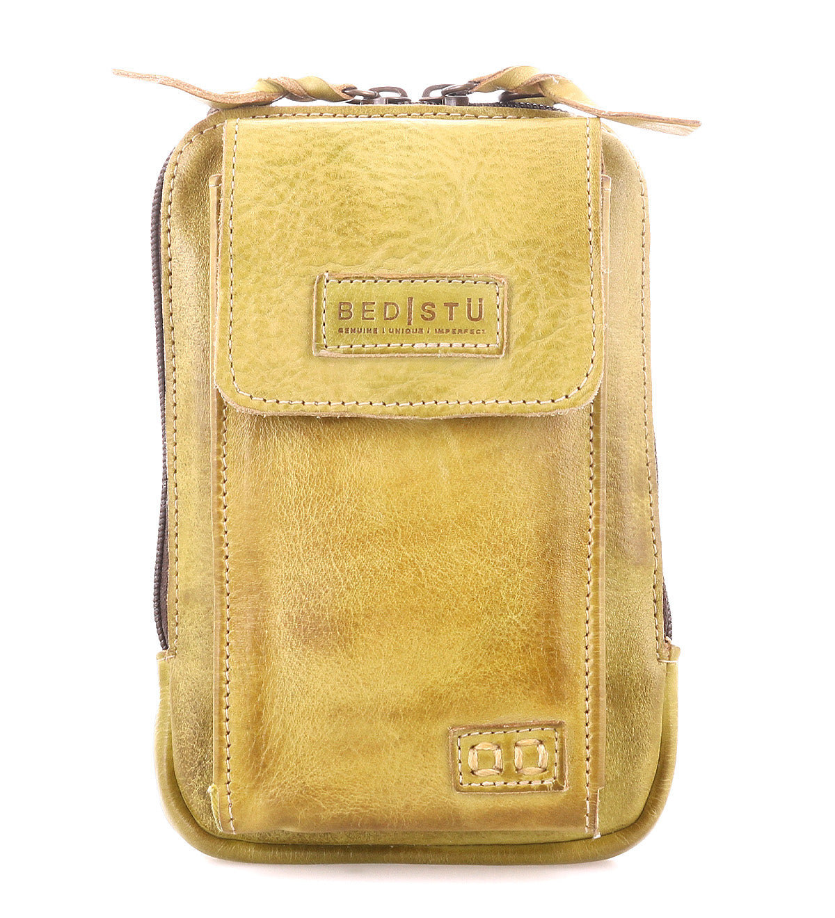 The Alelike by Bed Stu is a stylish mustard yellow leather pouch with a front flap, visible stitching, and a zipper. Crafted from premium leather, it features "Bed Stu" embossed on the front and is perfect for use as an on-the-go crossbody phone holder.