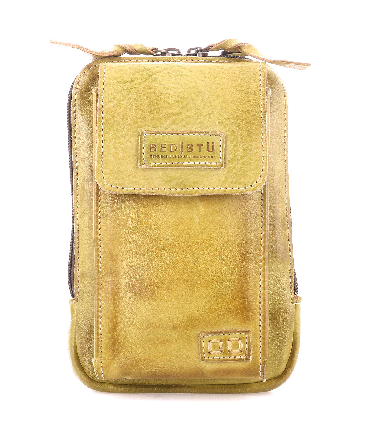The Alelike by Bed Stu is a stylish mustard yellow leather pouch with a front flap, visible stitching, and a zipper. Crafted from premium leather, it features "Bed Stu" embossed on the front and is perfect for use as an on-the-go crossbody phone holder.