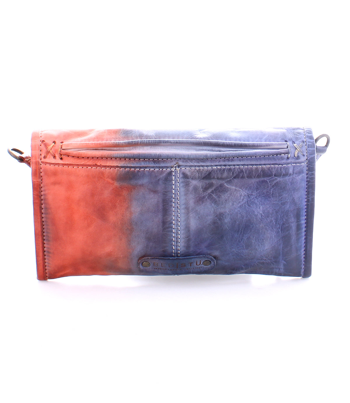 A small, rectangular, gradient leather crossbody clutch with magnetic flap and wrist strap, transitioning from orange to blue, the Amina by Bed Stu.
