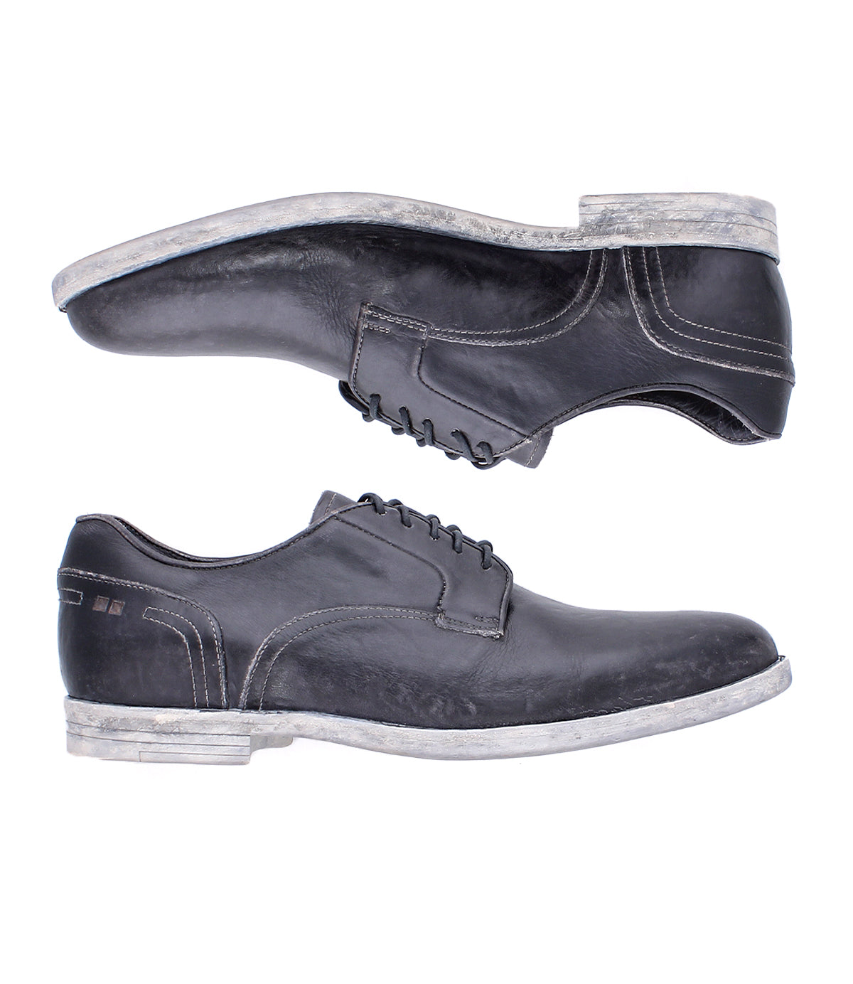 The Bed Stu Anchiano shoes are black distressed leather oxfords featuring white stitching and worn white soles, shown side by side on a white background.