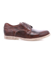 The Bed Stu Anchiano features brown leather oxfords with a distressed finish and a light, slightly scuffed sole for timeless style.