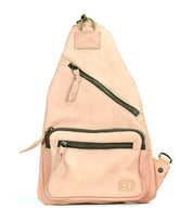 The Andie by Bed Stu is a beige leather crossbody sling bag with multiple zippered compartments and an adjustable strap, offering practicality for any occasion.