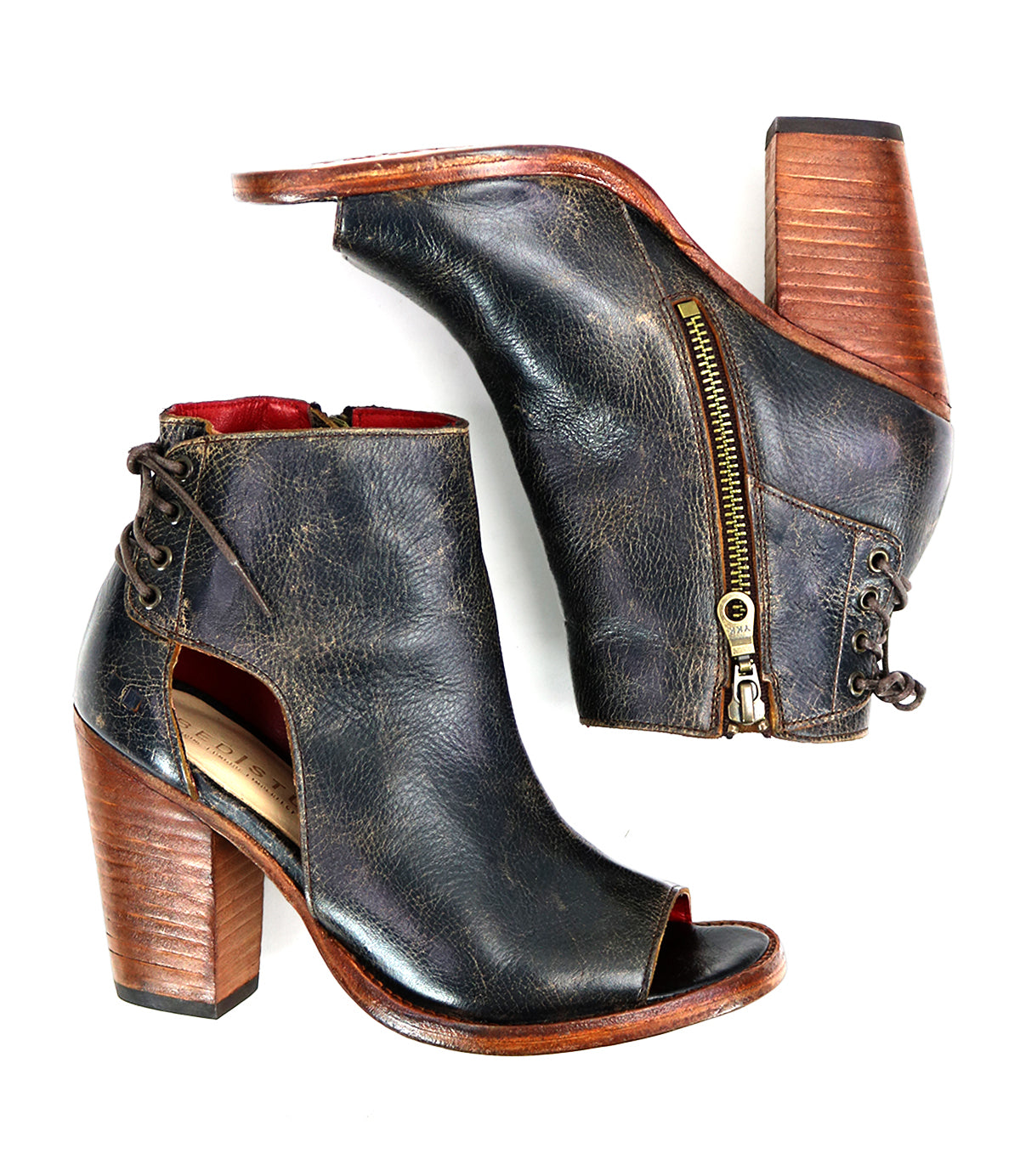 The Angelique by Bed Stu features distressed black leather, wooden block heels, side zippers, and elegant back lacing—ankle boots with a striking peep-toe design.