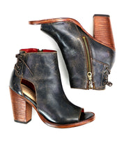 A pair of Bed Stu Angelique II black leather heeled boots with an inner zip and a wooden heel.