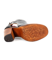 The back of an Angelique II by Bed Stu leather heeled shoe with a wooden sole and an inner zip.
