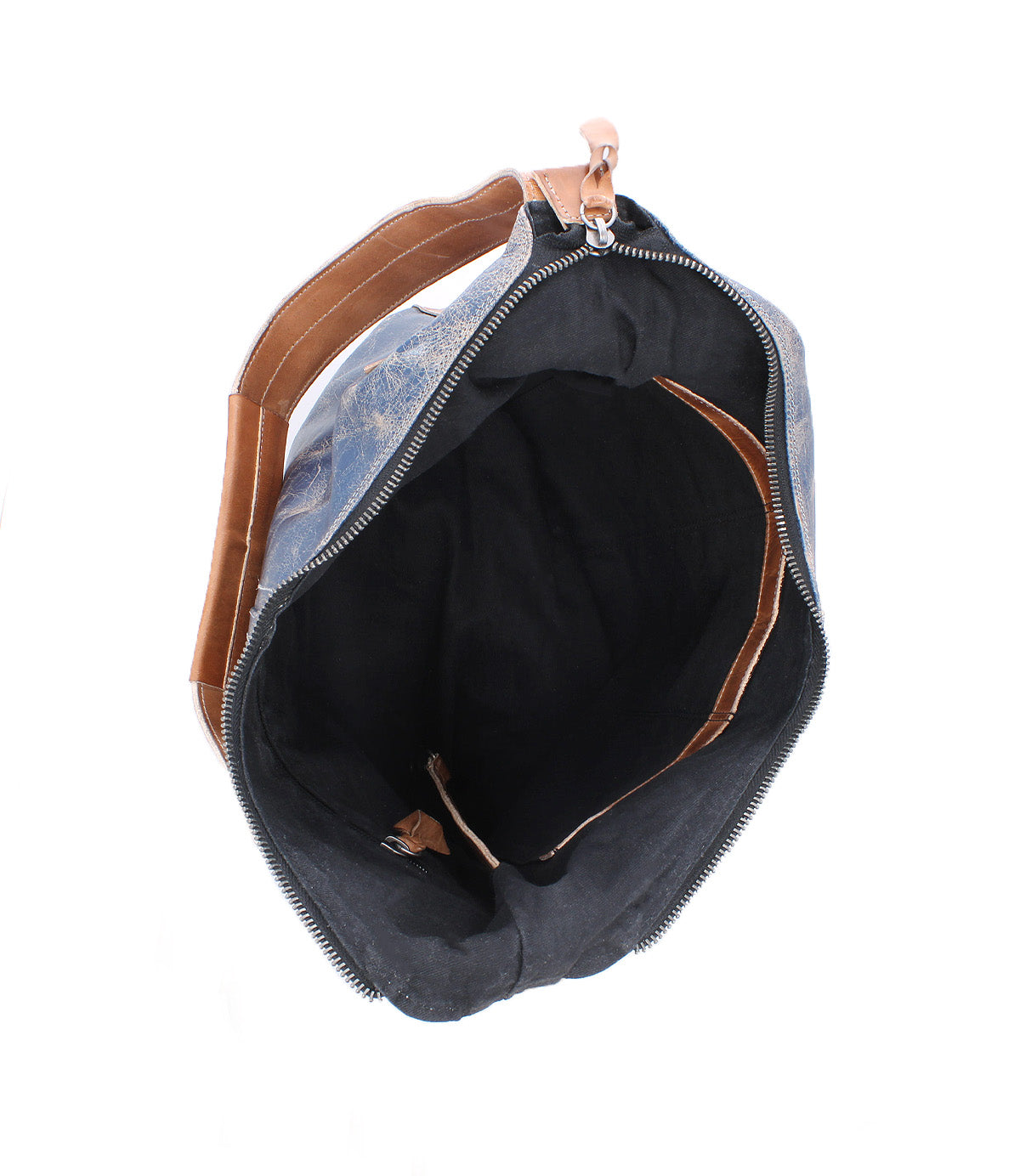Open top view of the empty Bed Stu Argus blue and brown patchwork leather bag featuring a black interior, zipper closure, and oversized front pockets.