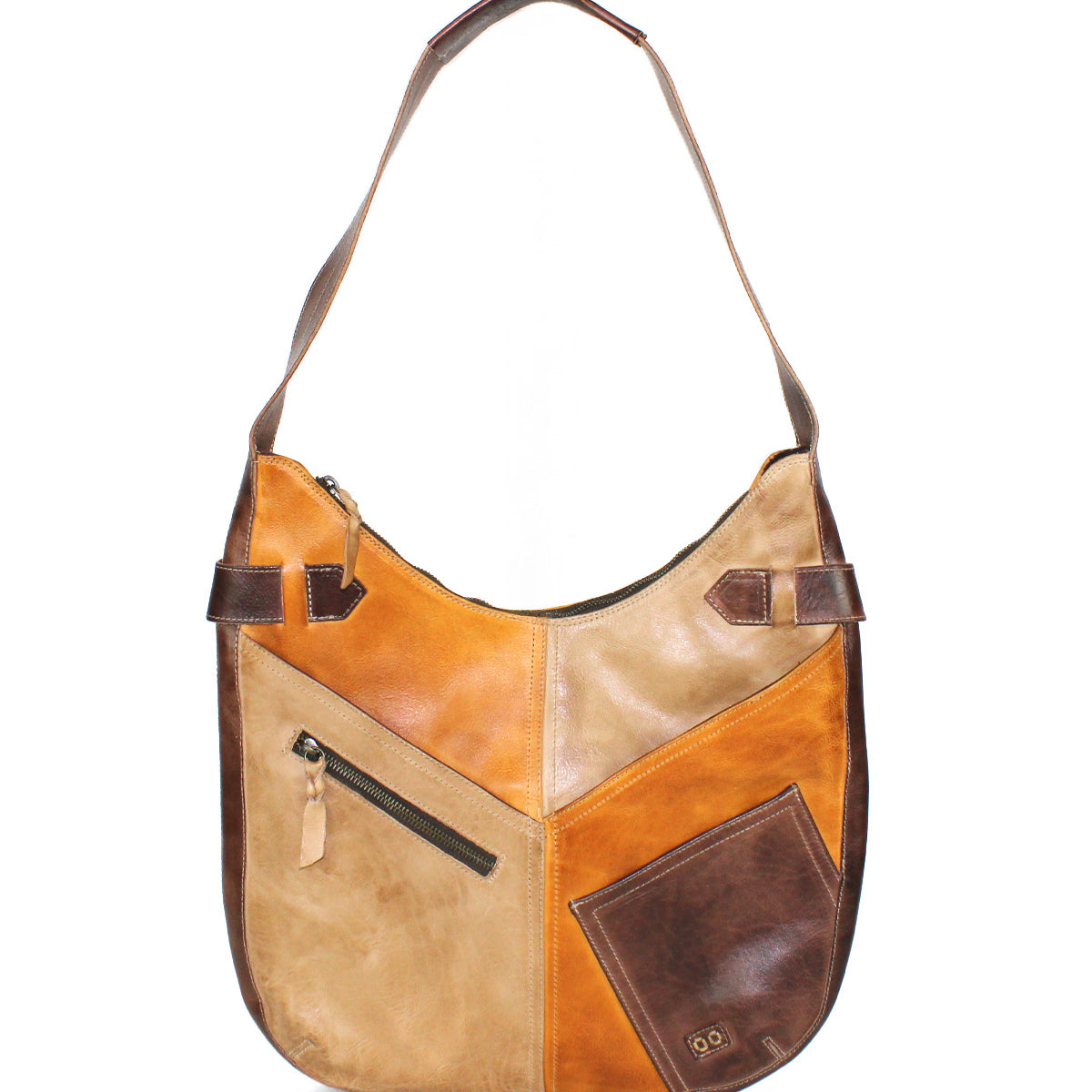 The Argus by Bed Stu is a handcrafted leather shoulder bag with a single strap, featuring patchwork in brown and tan, oversized front pockets, and visible stitching.